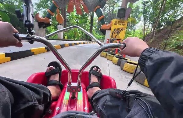 Scenic mountain cart track surrounded by tropical forest in Phuket