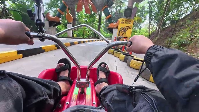 Scenic mountain cart track surrounded by tropical forest in Phuket